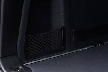 The luggage net inside modern car trunk.