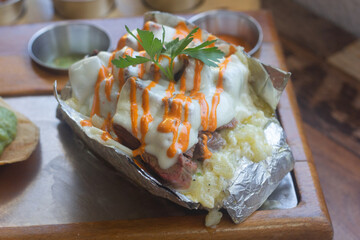Carne asada plate with mexican food and sauces