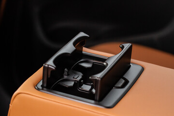 Cup holders inside modern car interior. Interior view of modern car.