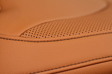 High angle view of modern car fabric seats. Close-up car seat texture and interior details. Detailed image of a car pleats stitch work. Leather seats.