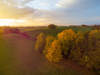 Aerial view of sunset behind a field in the countryside
