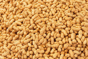 Peanut in a shell texture, food background.