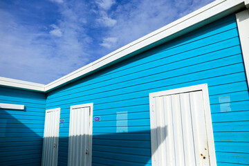 Fototapeta premium Colorful wooden toilets on the beach
