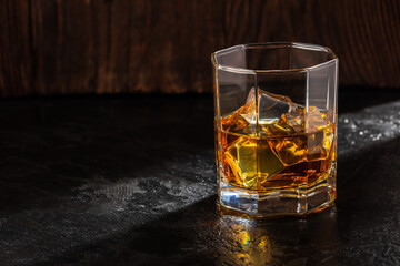 Whiskey with Ice on a Wooden Table