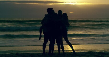 Silhouette, travel and sunset with family at beach for summer break, tropical and relax. Freedom, destination and hug with parents and children in embrace on shoreline for affection, content or calm