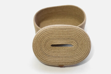 Wicker basket for jute napkins on a white isolated background.Wicker napkin holder