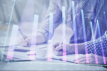 Multi exposure of forex chart with man working on computer on background. Concept of market analysis.