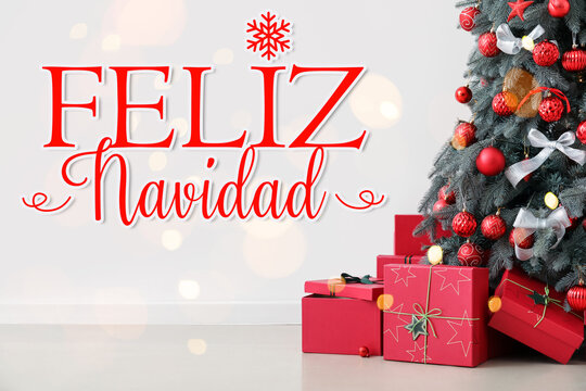 Greeting card with decorated fir tree, gifts and text FELIZ NAVIDAD (Spanish for Merry Christmas)