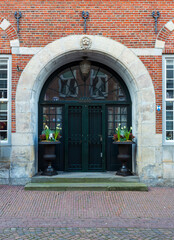 Fototapeta na wymiar A charming town in the Netherlands, Ootmarsum, beautiful gate and street.