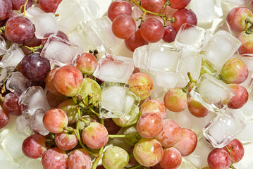 Bunch of sweet grapes in ice, closeup