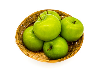 a basket of green apples on a white background. Healthy foods and diet foods. Fruits and healthy eating. Green apples, source of health and flavor