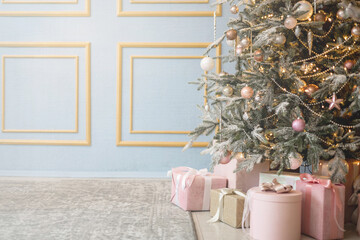 Festive winter holiday decorated Christmas tree with hanging toys garland cosiness home apartment