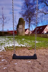 Close up of empty swing at park. Close-up of a playground and an empty swing.. Indispensable fun of children: Swing