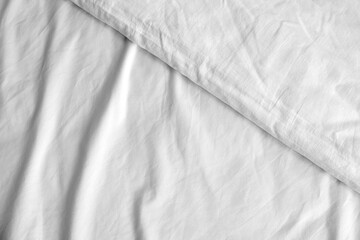 Soft white bed sheets, closeup