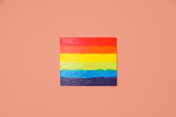 Painting of LGBT flag on color wall