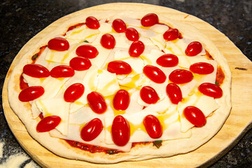 Preparing traditional Neapolitan pizza and Italian ingredients