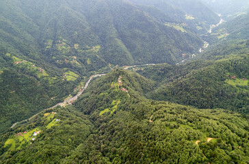 Fototapeta na wymiar aerial view of foggy forests. Drone shot of the Kackar Mountains in spring. Camlihemsin Rize, Turkey