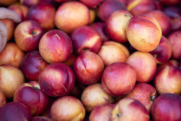 Fototapeta na wymiar Fresh and organic peaches at farmers market