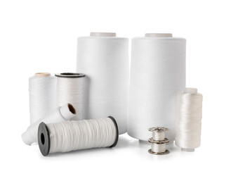 Different thread spools isolated on white background