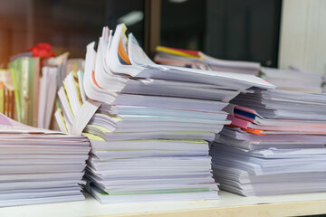 Pile of Document papers or paperwork file unfinished report on table busy office. Stack financial...
