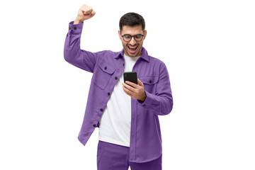 We've got a winner! Happy young man in purple shirt looking at phone screen with victory expression