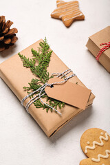 Christmas gifts and cookies on light background, closeup