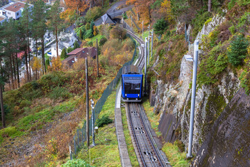 Fototapeta premium Floibanen funicular to Mt Floyen at Bergen City, from Top of Mount Floyen Glass Balcony Viewpoint mountain in Norway