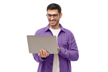 Young happy man standing with opened laptop, browsing online or typing message - 548614314