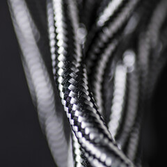 Black and White Braided Cable on Black Background
