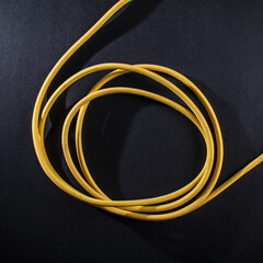Yellow Braided Cable on Black Background