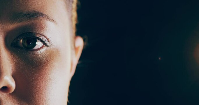 Black woman, face and eyes in awareness on mockup for advertising or marketing with copyspace for text or message. Closeup portrait of African American female awake opening eye on black background