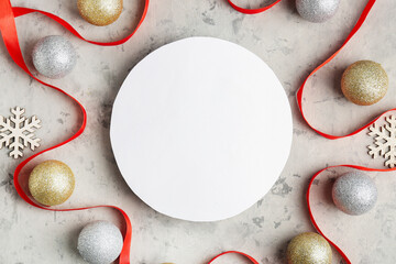 Composition with blank card, Christmas decorations and ribbon on grunge background