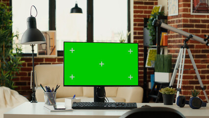 Empty office with monitor and greenscreen on computer, showing chroma key display and isolated...
