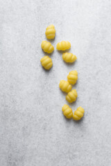 Flat lay of uncooked Gnocchetti pasta shells, top view of gnocchi pasta shells, dry uncooked macaroni