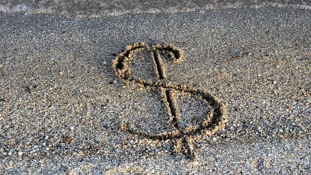 Dollar sign on sand. Sand and currency.