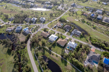 Hurricane Ian destroyed homes in Florida residential area on golf course. Natural disaster and its consequences