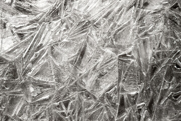 The texture of the ice surface. Winter background, festive background in the form of ice crystals, in natural color. 