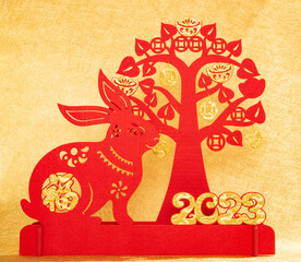 Chinese New Year of Rabbit mascot with cash cow on gold background the Chinese word means fortune no logo no trademark