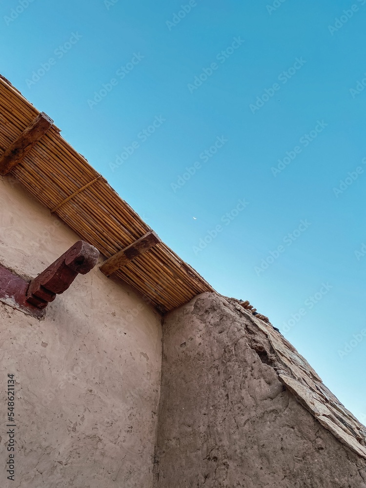 Sticker Closeup of an old adobe church under the clear blue sky in Catamarca, Argentina