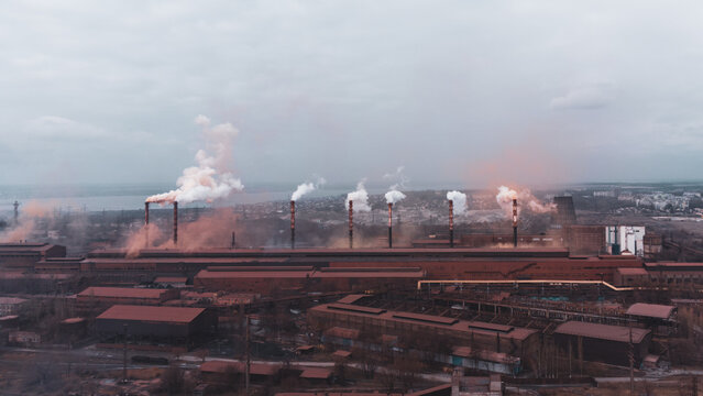 A Chimney Chemical Plant In The Discharge Of Pollutants, Industry Pipes Pollute The Atmosphere Smoke