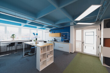 Photo of a modern office where programming, digital marketing and web design projects are done. Office with modern furniture and glass office