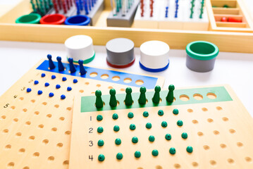 The division board in montessori is a mathematical material to learn in an alternative way.