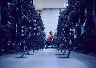 Female technician working in server room