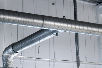 large steel ventilation pipes in industrial premises, ceiling ventilation