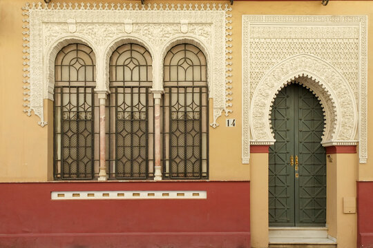 Spain, Seville, Moorish style building with arched entrance and windows&nbsp;