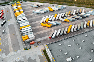 Aerial view of loading trucks in the logistics center of a large transport company