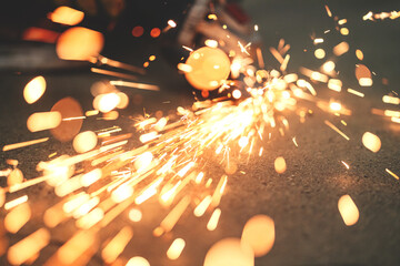 White hot sparks when grinding steel, metalworking