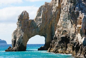 The rock formation of a natural Arch near Cabo San Lucas, Mexico - Powered by Adobe