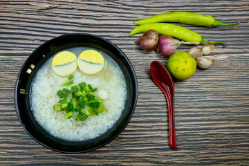 My breakfast is boiled rice with eggs topping spring onion and pepper It is a light menu in Thai style.