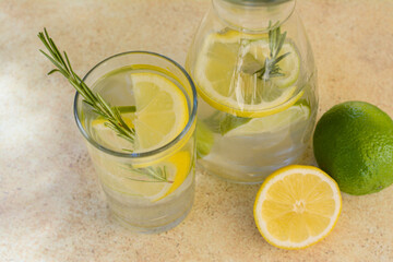 Tasty refreshing lemonade and ingredients on light table. Summer drink